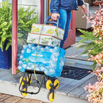 Climb Cart mit Wasserflaschen und Kartons beladen, bereit zum Transport aus dem Haus.