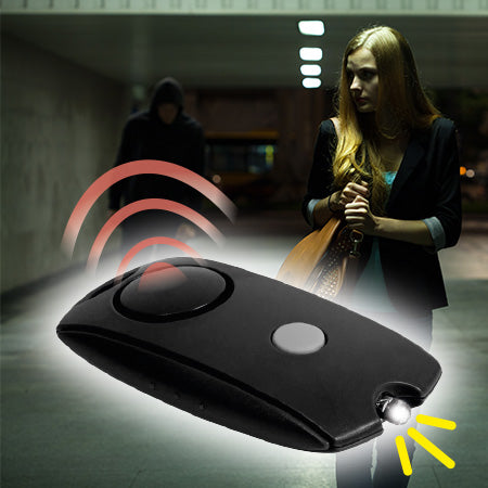 Der Personal Alarm wird vor bedrohlicher Szene gezeigt – mit LED-Licht und Sirenensymbol als Abschreckung bei Gefahr.